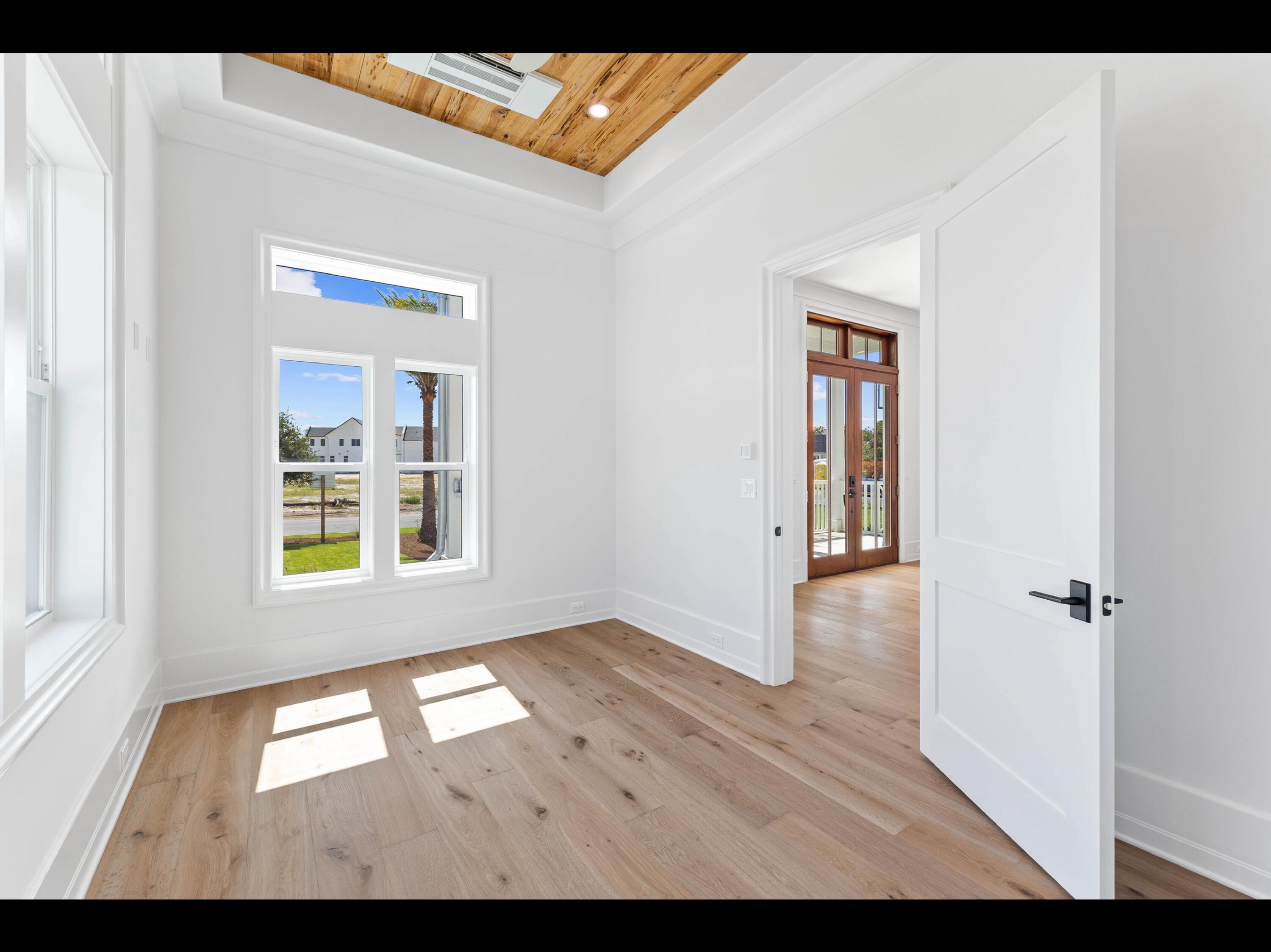 19 Quail Hollow Inlet Beach, FL 32461 - Photo 50 of 84 a view of an empty room with wooden floor and a window