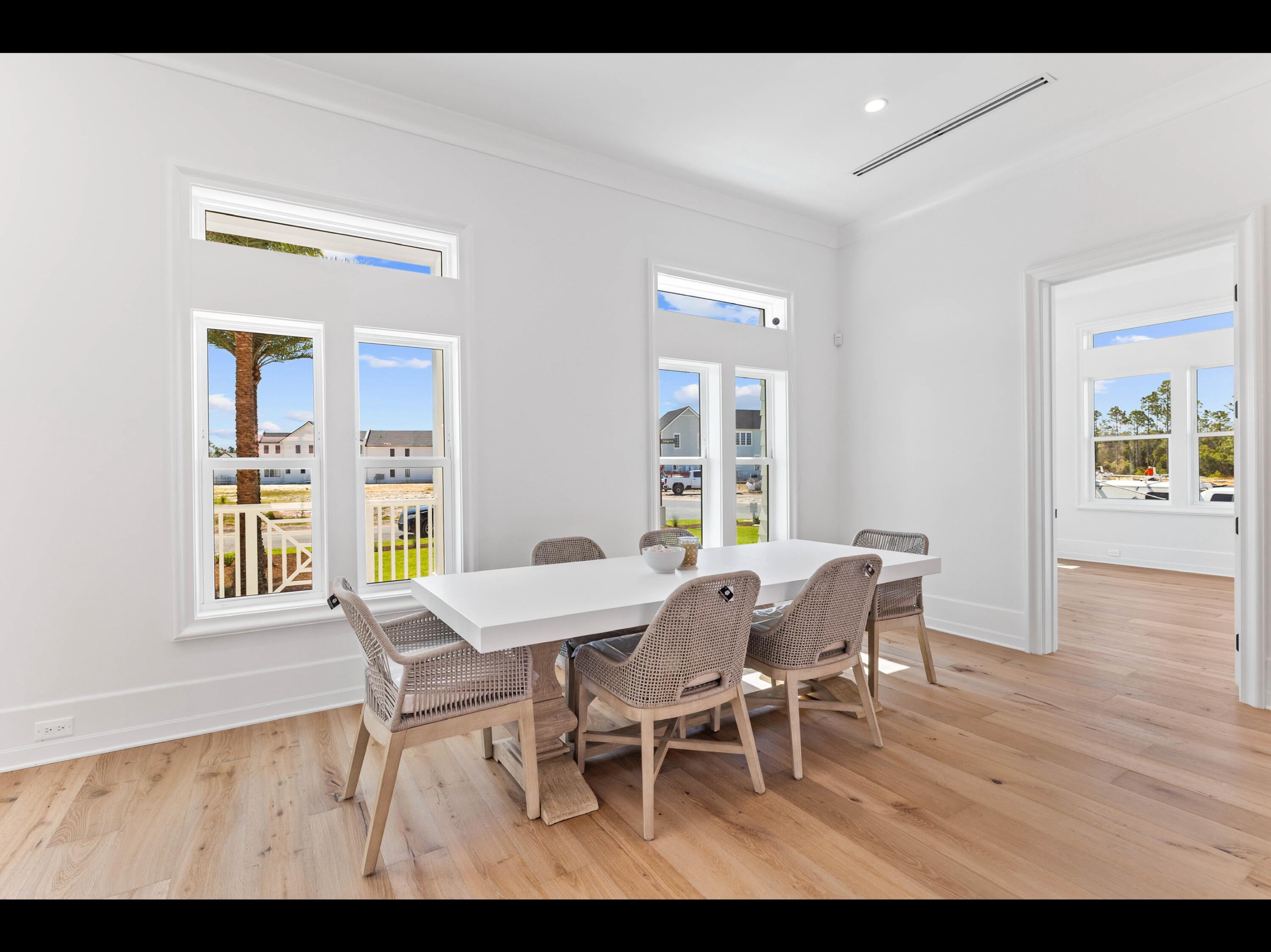 19 Quail Hollow Inlet Beach, FL 32461 - Photo 51 of 84 a view of a dining room with furniture and a window