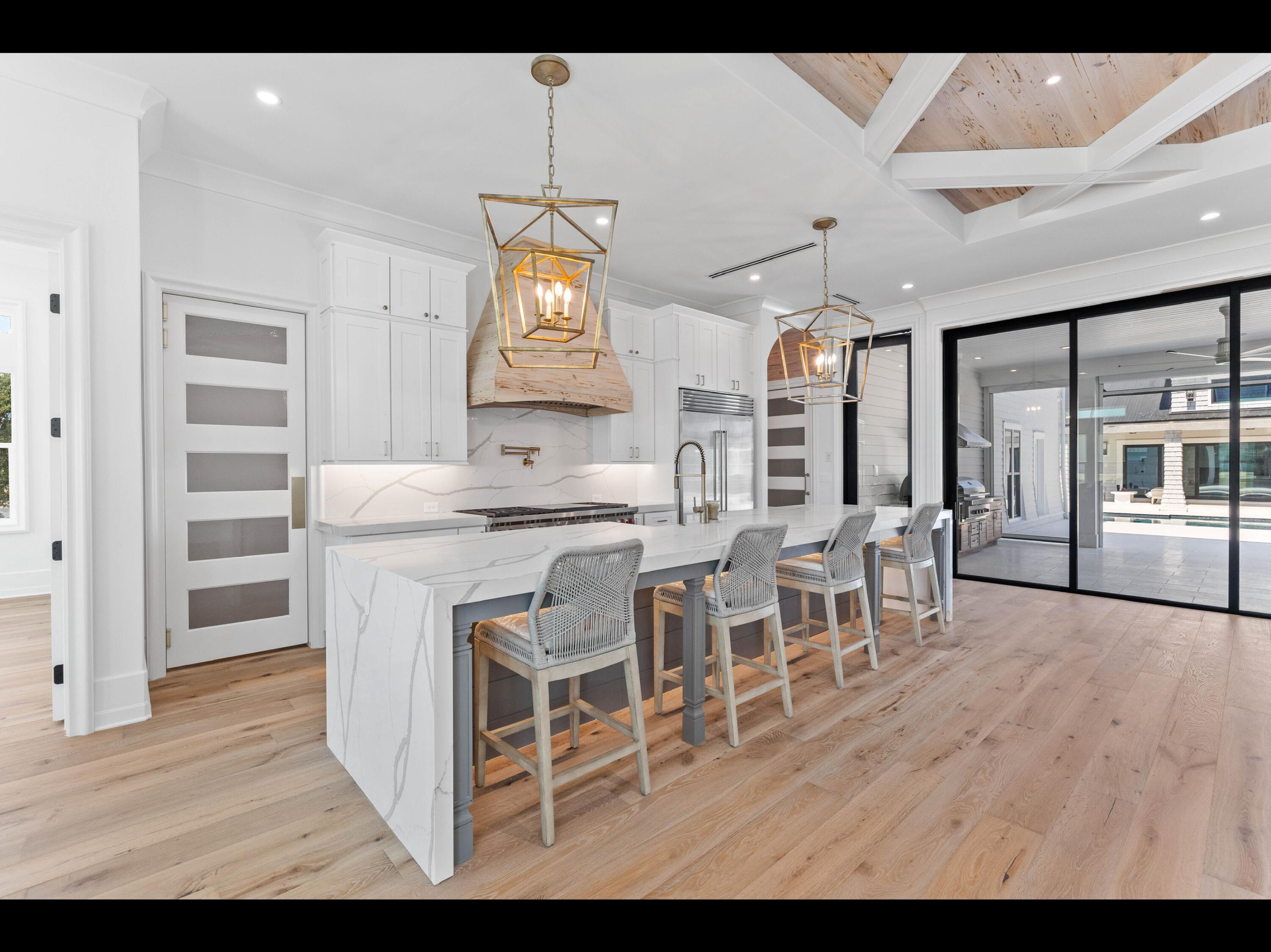 19 Quail Hollow Inlet Beach, FL 32461 - Photo 54 of 84 a view of a dining room with furniture and wooden floor