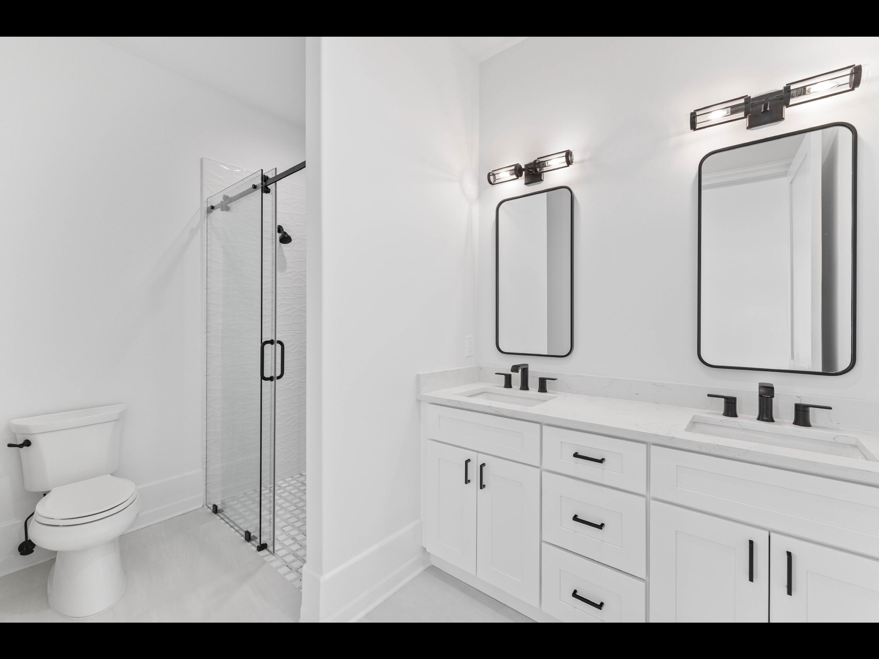 19 Quail Hollow Inlet Beach, FL 32461 - Photo 72 of 84 a bathroom with a double vanity sink toilet mirror and shower