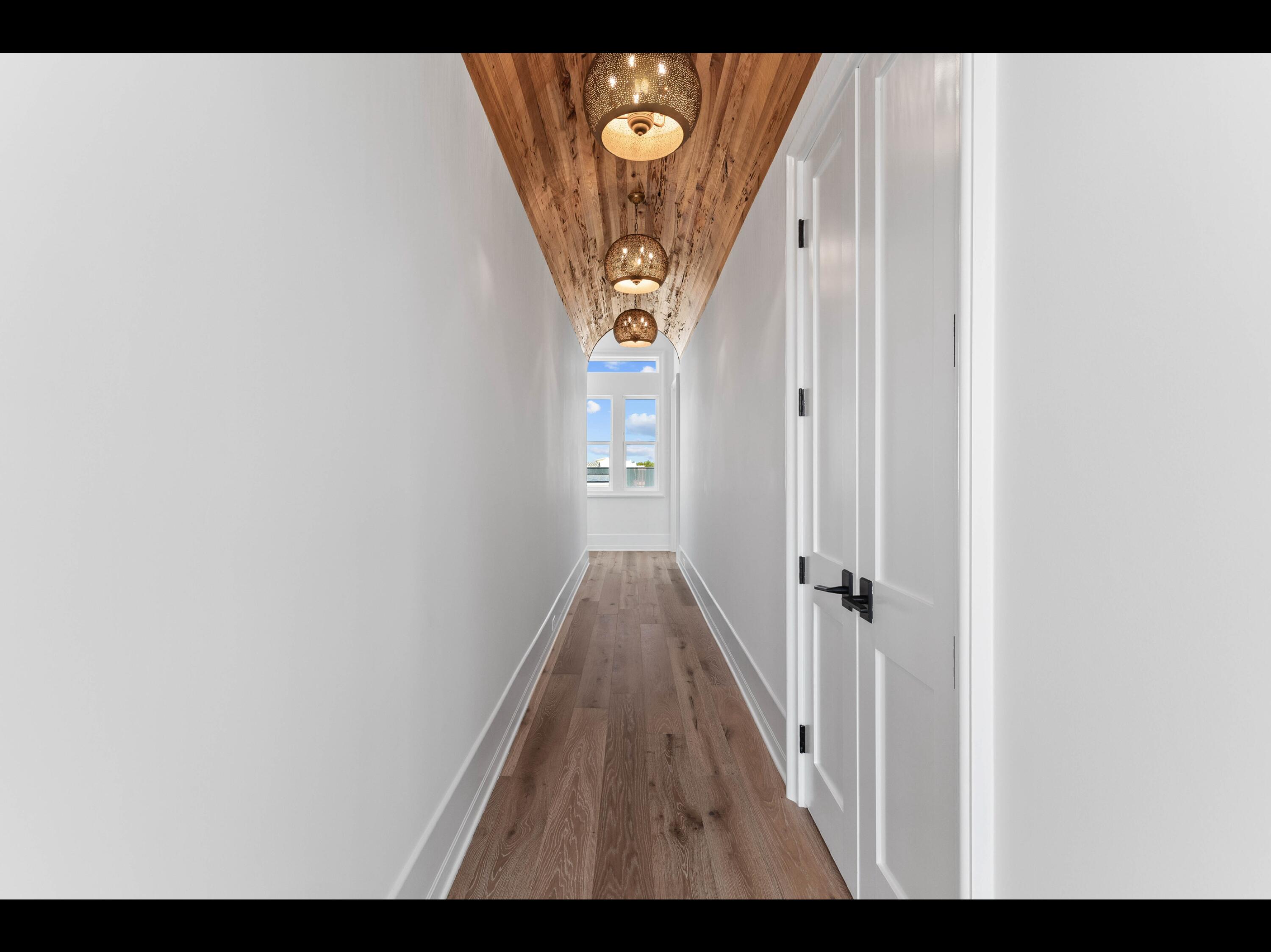 19 Quail Hollow Inlet Beach, FL 32461 - Photo 73 of 84 a view of a hallway with wooden floor and staircase