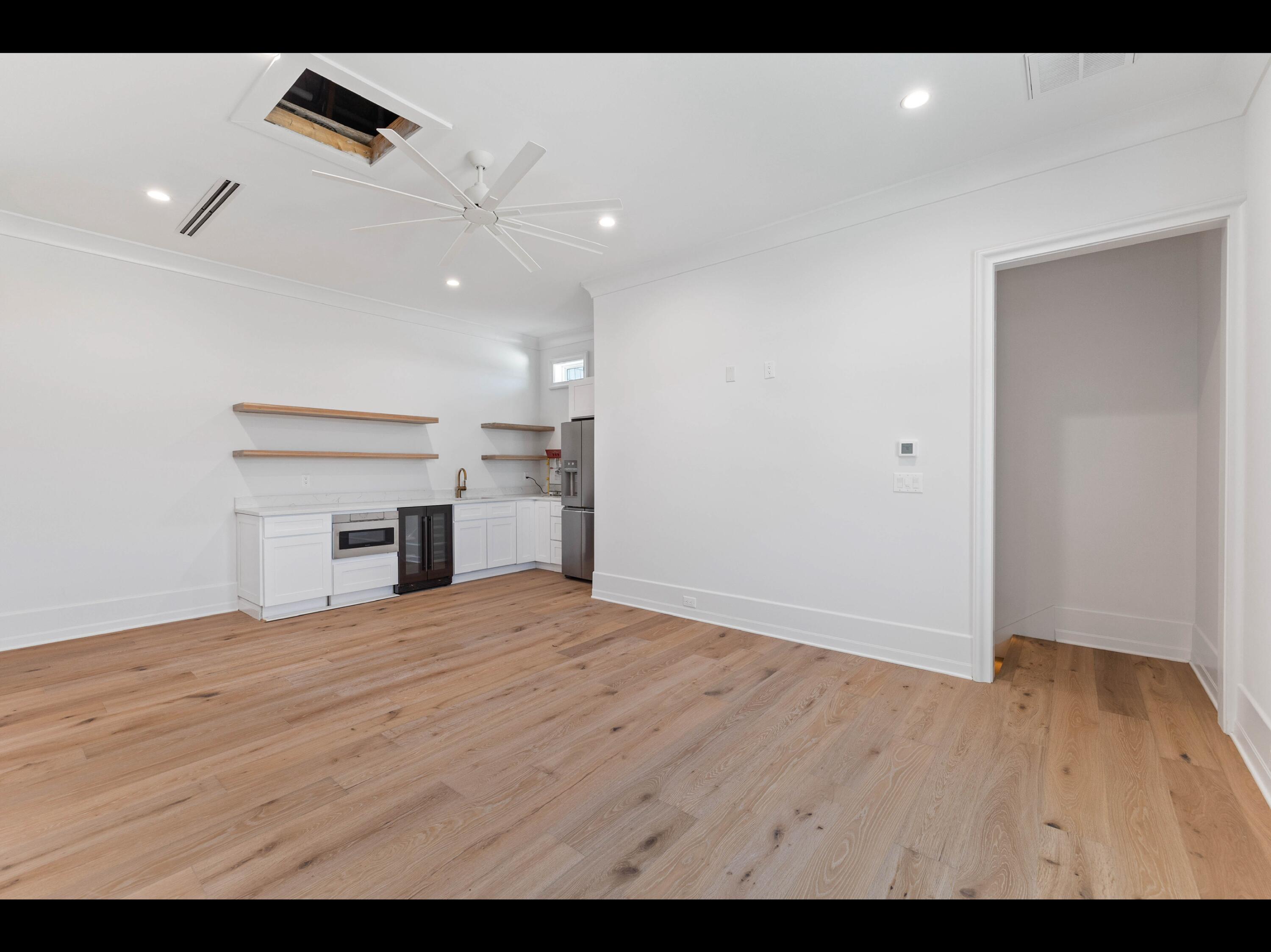 19 Quail Hollow Inlet Beach, FL 32461 - Photo 76 of 84 a view of empty room with kitchen appliances and a ceiling fan