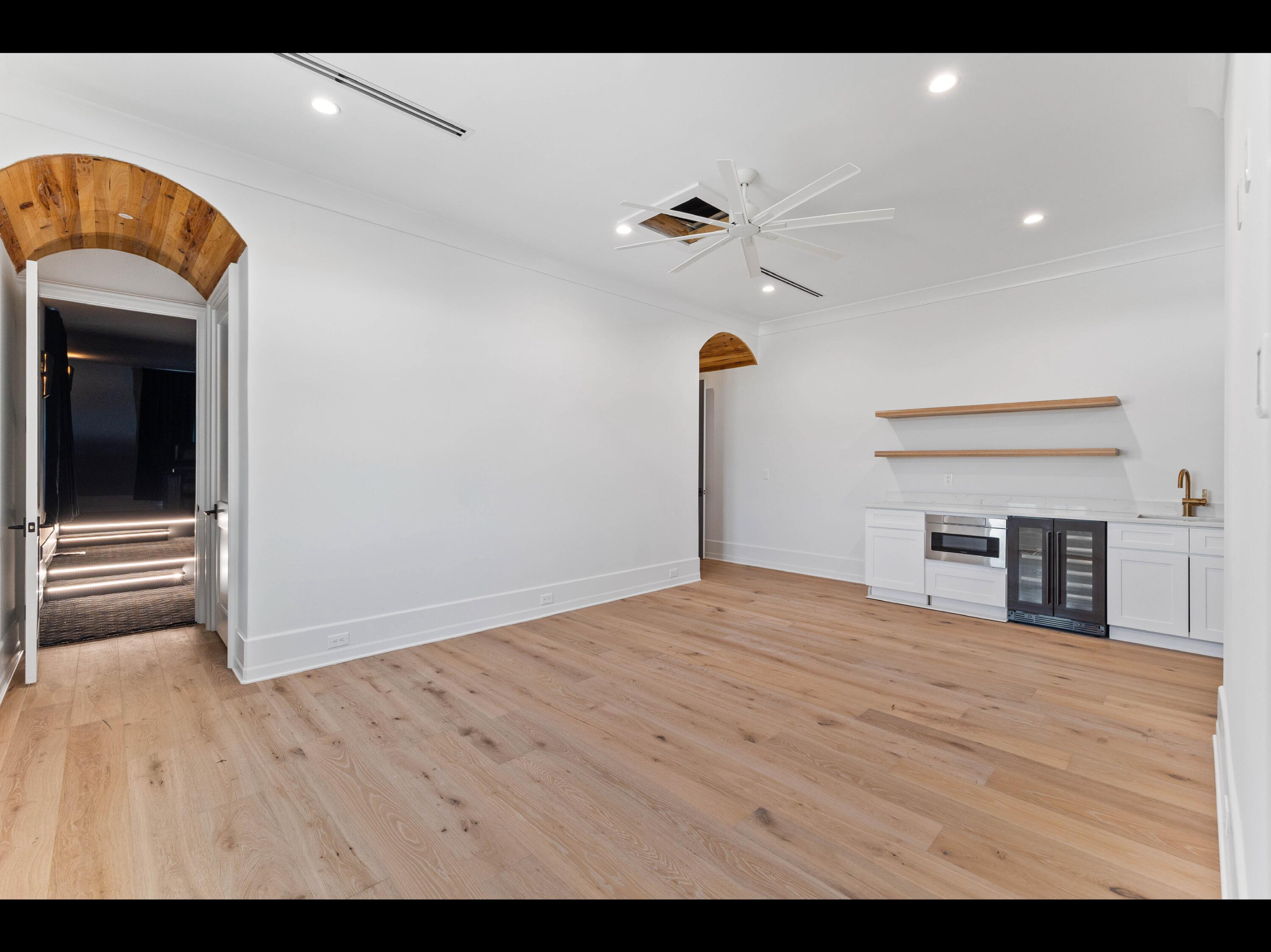19 Quail Hollow Inlet Beach, FL 32461 - Photo 77 of 84 a view of empty room with wooden floor and fan