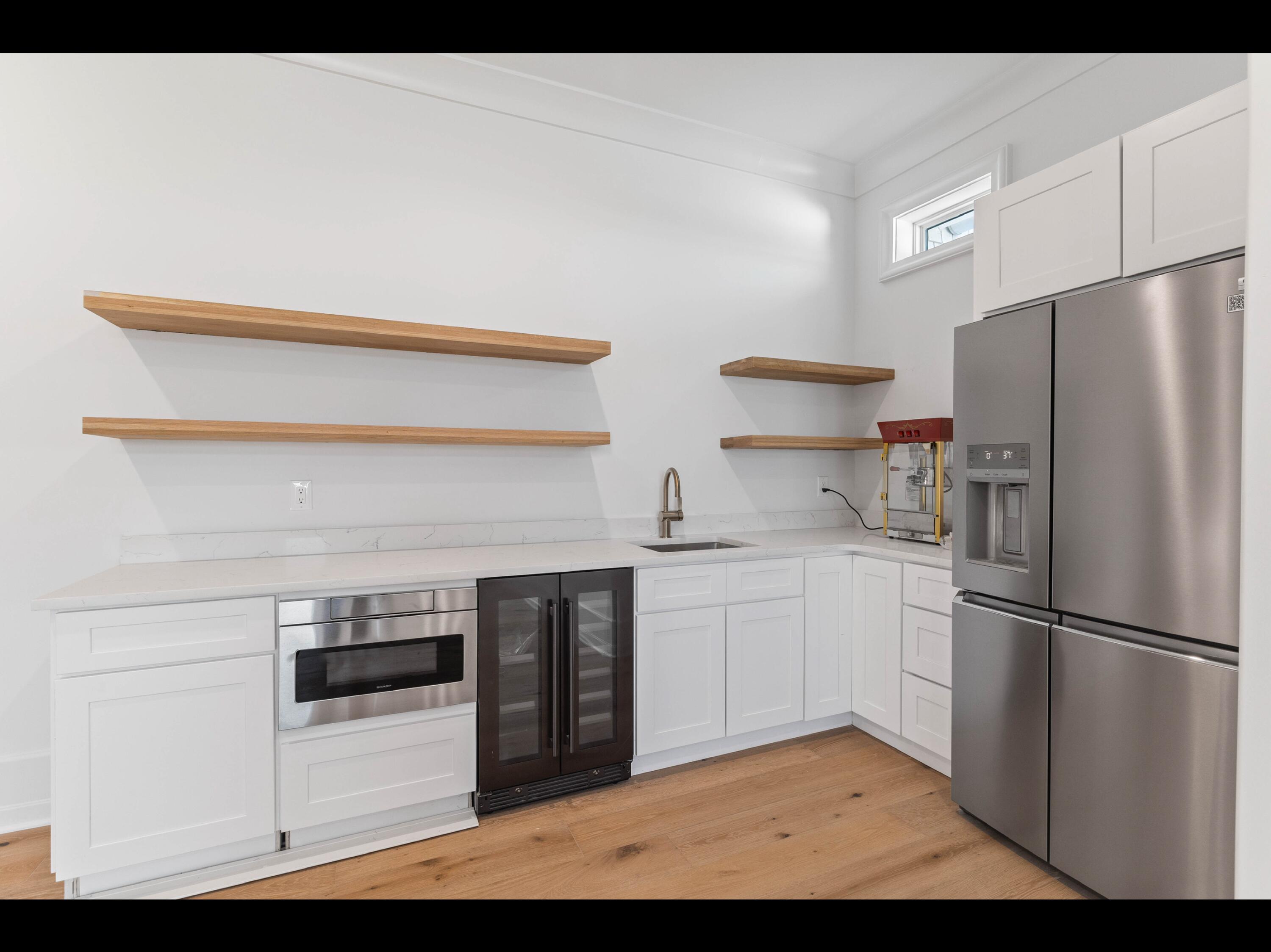 19 Quail Hollow Inlet Beach, FL 32461 - Photo 78 of 84 a kitchen with a refrigerator and a stove