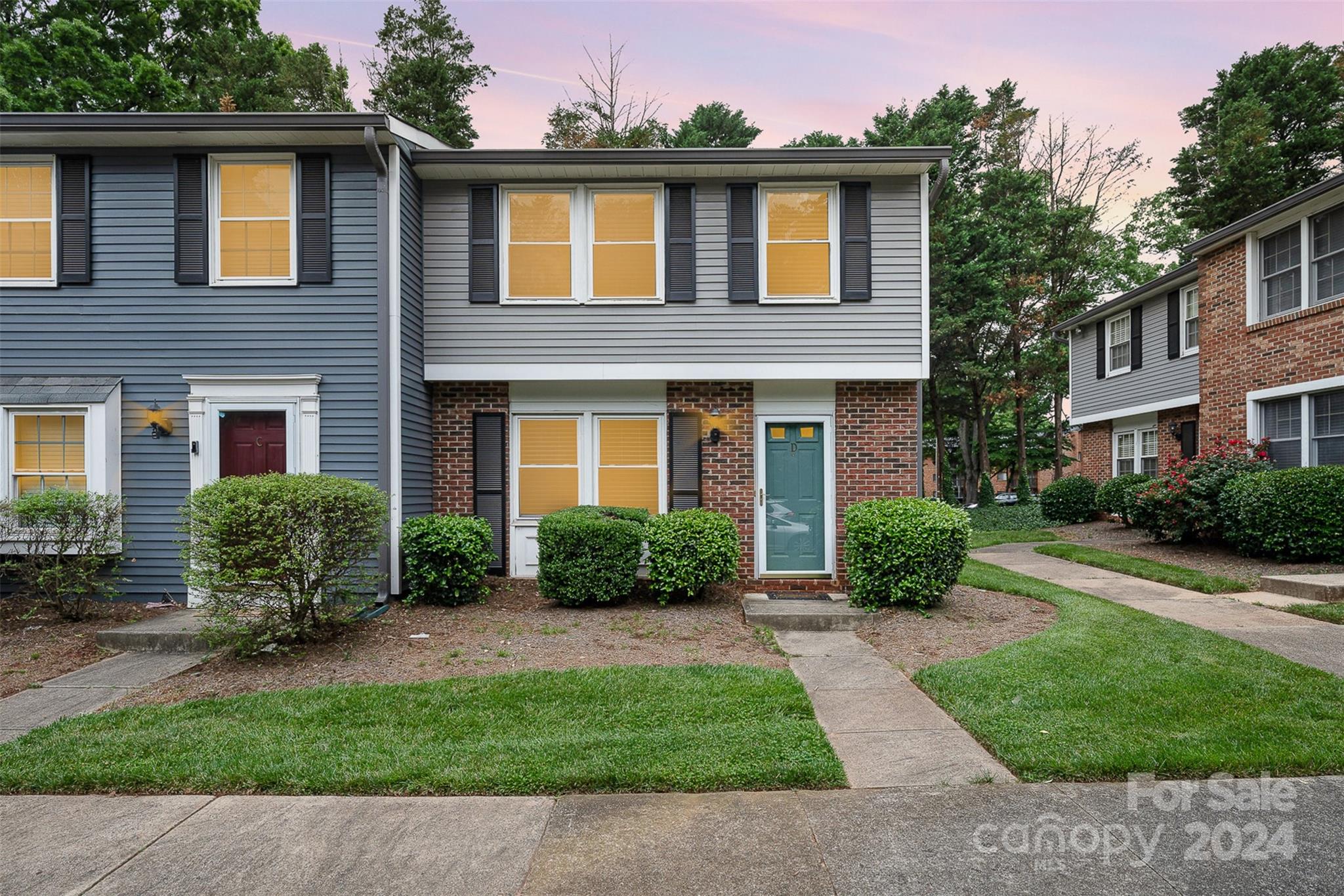1201 Scaleybark Road, Unit D Charlotte, NC 28209 - Photo 1 of 37 front view of a brick house with a yard