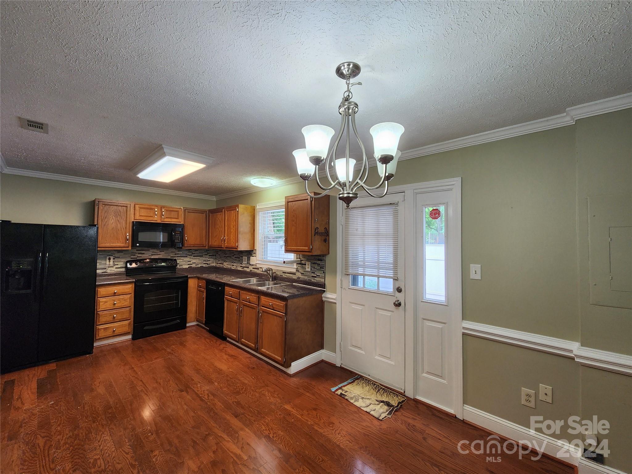 1201 Scaleybark Road, Unit D Charlotte, NC 28209 - Photo 11 of 37 a large kitchen with stainless steel appliances granite countertop a stove and refrigerator