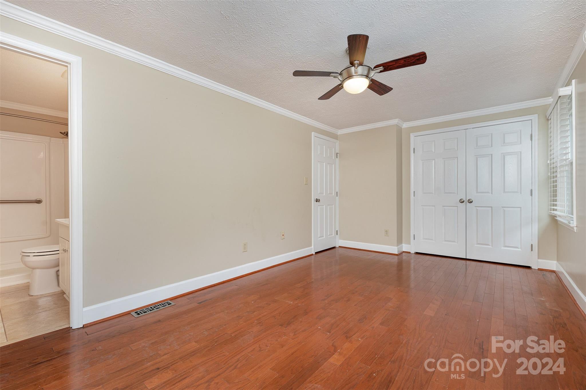 1201 Scaleybark Road, Unit D Charlotte, NC 28209 - Photo 17 of 37 wooden floor in an empty room with a window