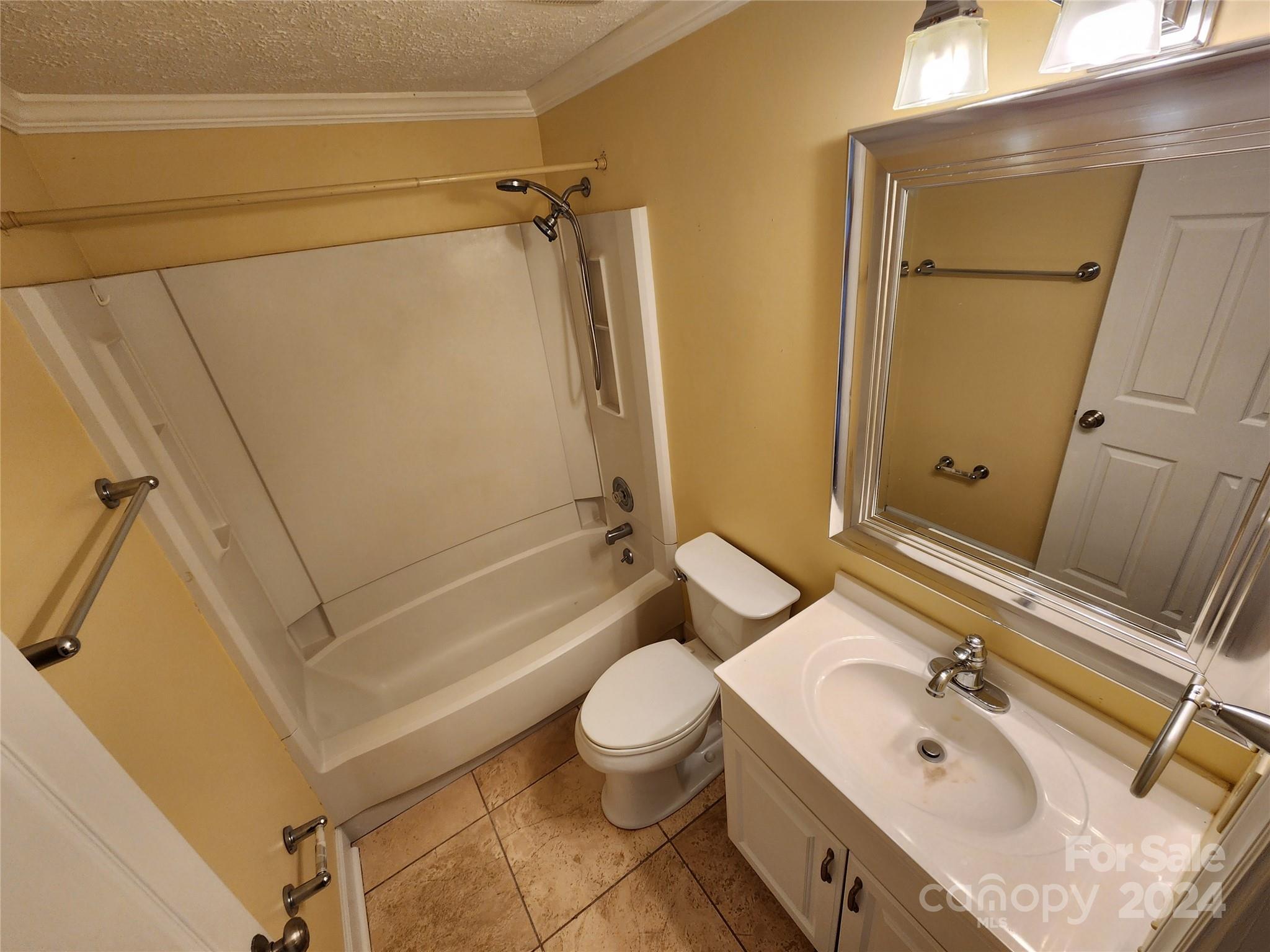 1201 Scaleybark Road, Unit D Charlotte, NC 28209 - Photo 24 of 37 a bathroom with a sink a toilet and shower