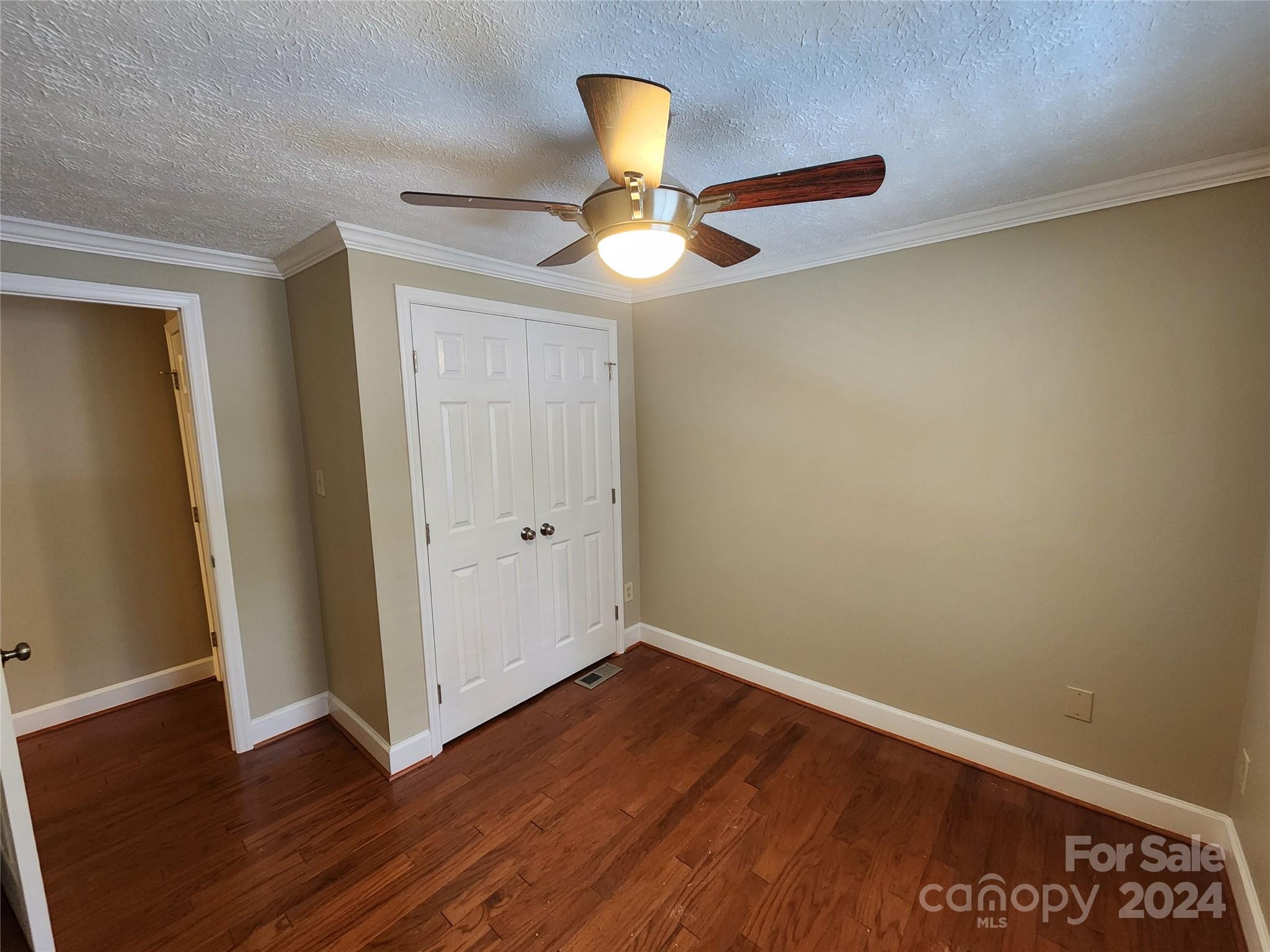 1201 Scaleybark Road, Unit D Charlotte, NC 28209 - Photo 25 of 37 a view of an empty room with wooden floor