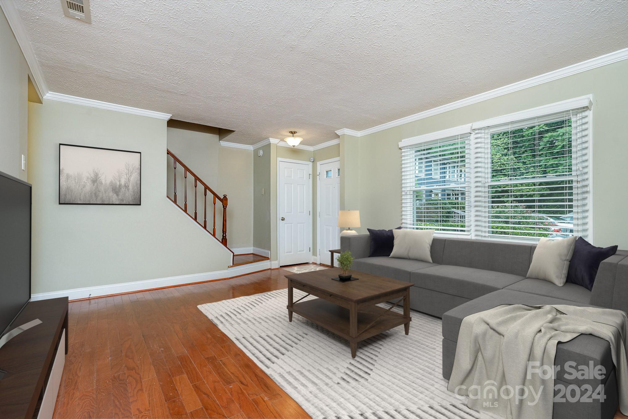 1201 Scaleybark Road, Unit D Charlotte, NC 28209 - Photo 5 of 37 a living room with furniture and a table