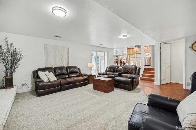 a living room with furniture and a couch