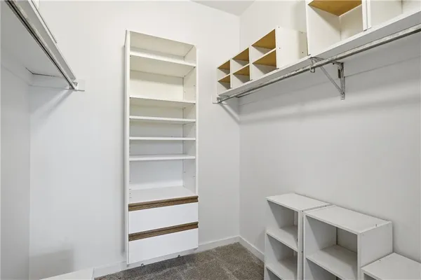 a view of an empty walk in closet