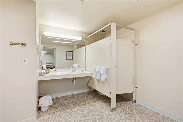 a bathroom with a sink and mirror