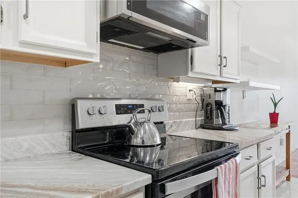 a kitchen with a sink and cabinets