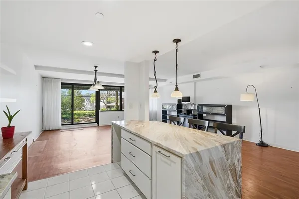 a kitchen with sink and cabinets