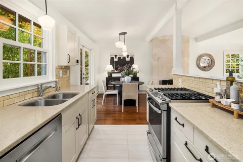 a kitchen with a stove and a sink