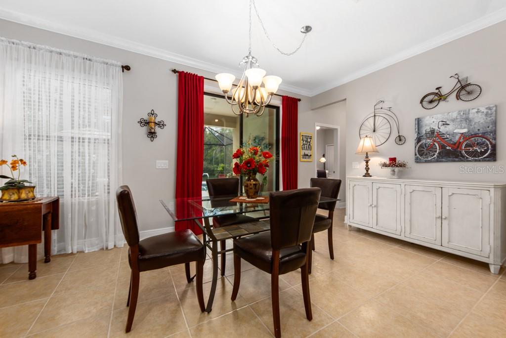 15437 Mulholland Road Parrish, FL 34219 - Photo 19 of 47 The spacious Eat-In Area of the Kitchen which is also adjacent to the sliders to the Lanai!