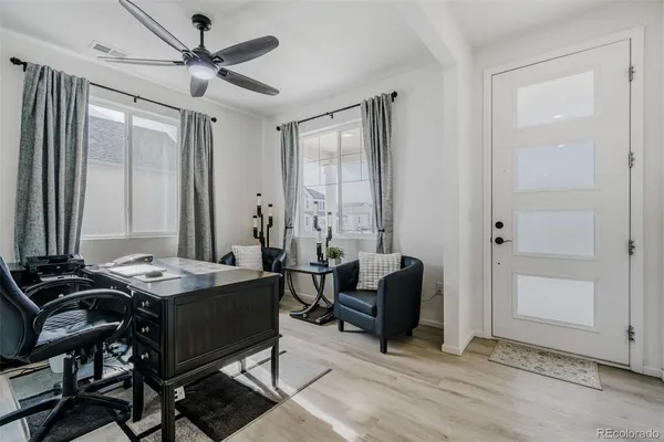 a view of a livingroom with furniture and window