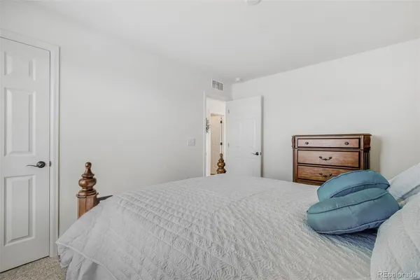 a bedroom with a bed and closet
