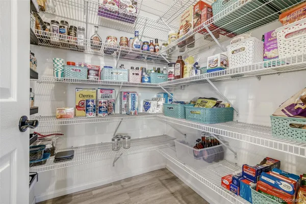 a cabinet with white and a white kitchen