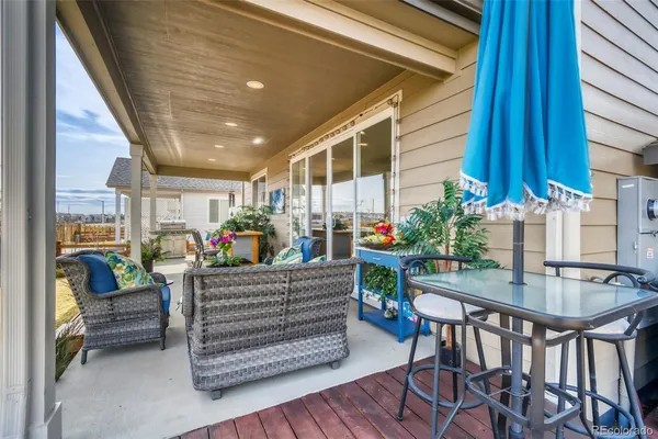 a outdoor living space with furniture and a potted plant