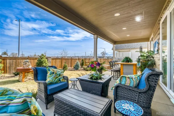 a outdoor living space with furniture and a potted plant
