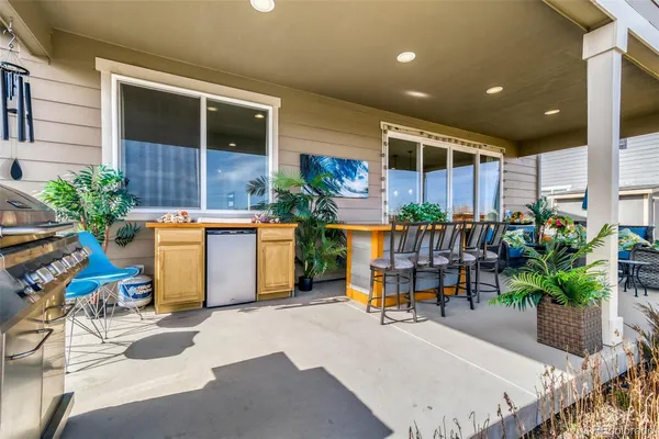 a work place with potted plants and a table