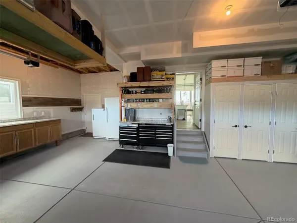a kitchen with a stove and a refrigerator