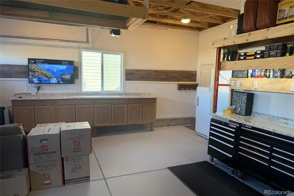 a kitchen with a cabinets and window
