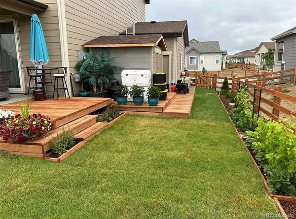 a front view of a house with a yard table and chairs