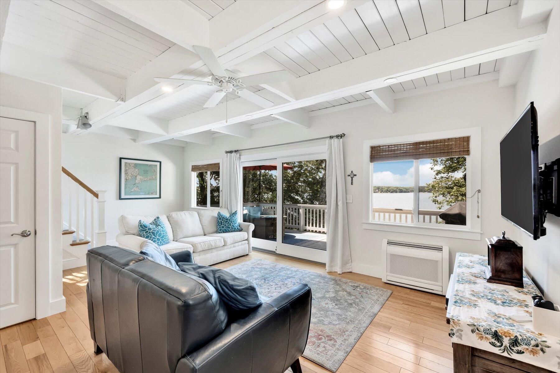 120 Wheeler Road Mashpee, MA 02649 - Photo 11 of 49 a living room with furniture and a flat screen tv