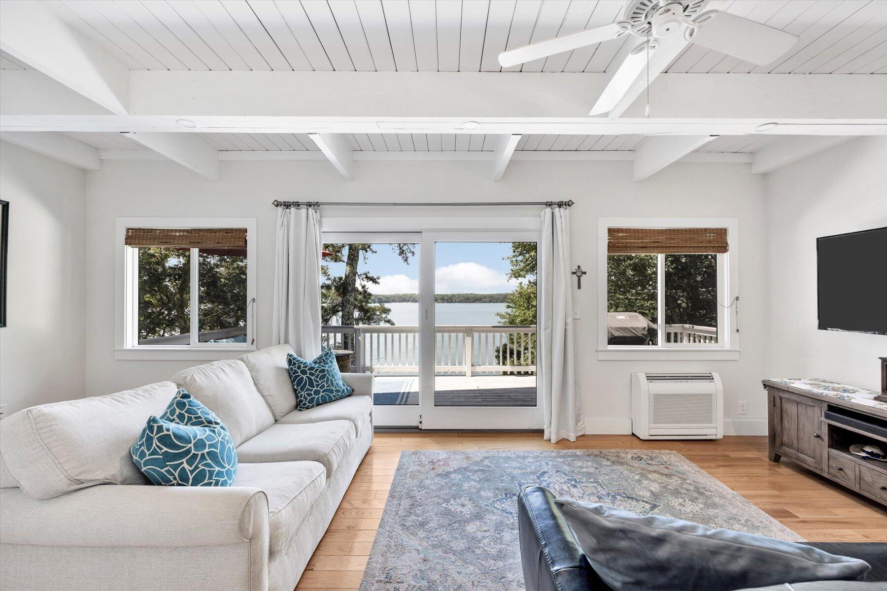 120 Wheeler Road Mashpee, MA 02649 - Photo 12 of 49 a living room with furniture and a fireplace