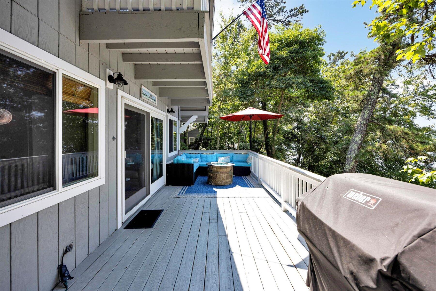 120 Wheeler Road Mashpee, MA 02649 - Photo 14 of 49 a balcony with table and chairs