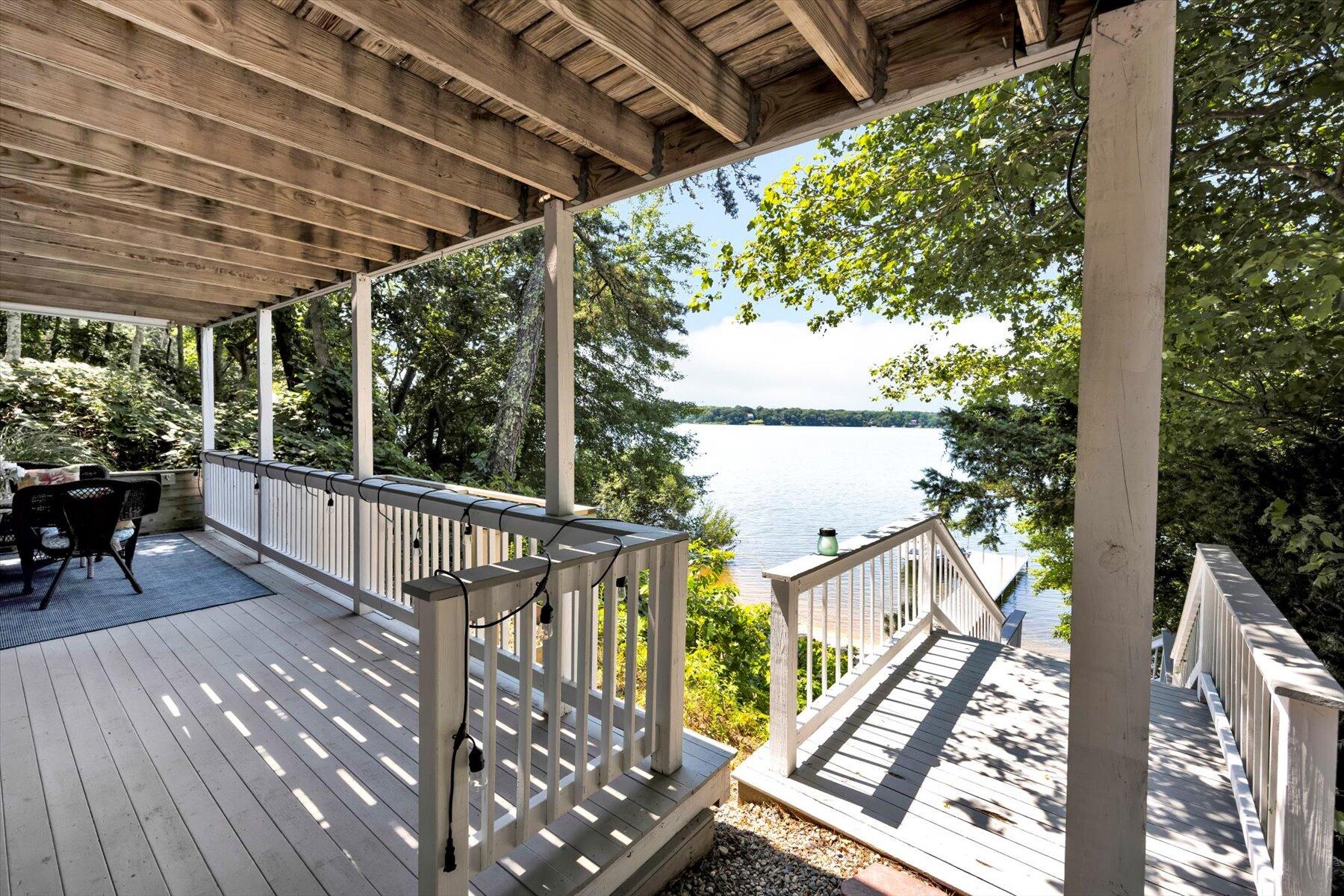120 Wheeler Road Mashpee, MA 02649 - Photo 18 of 49 a view of balcony with wooden floor and outdoor seating