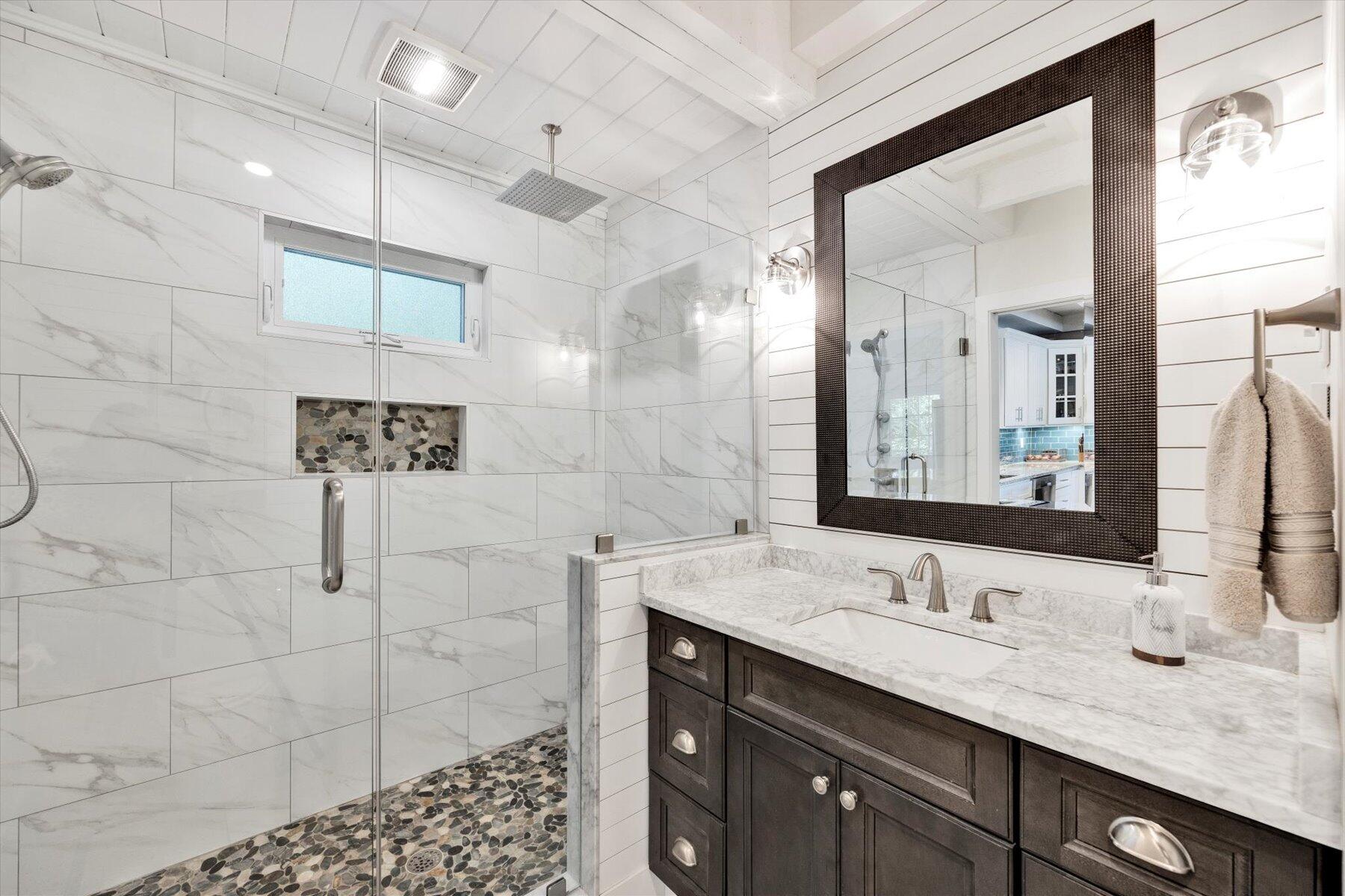 120 Wheeler Road Mashpee, MA 02649 - Photo 20 of 49 a bathroom with a granite countertop sink a mirror and shower