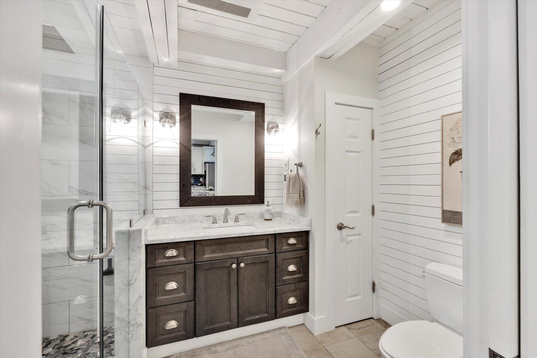 120 Wheeler Road Mashpee, MA 02649 - Photo 21 of 49 a bathroom with a toilet a sink and mirror