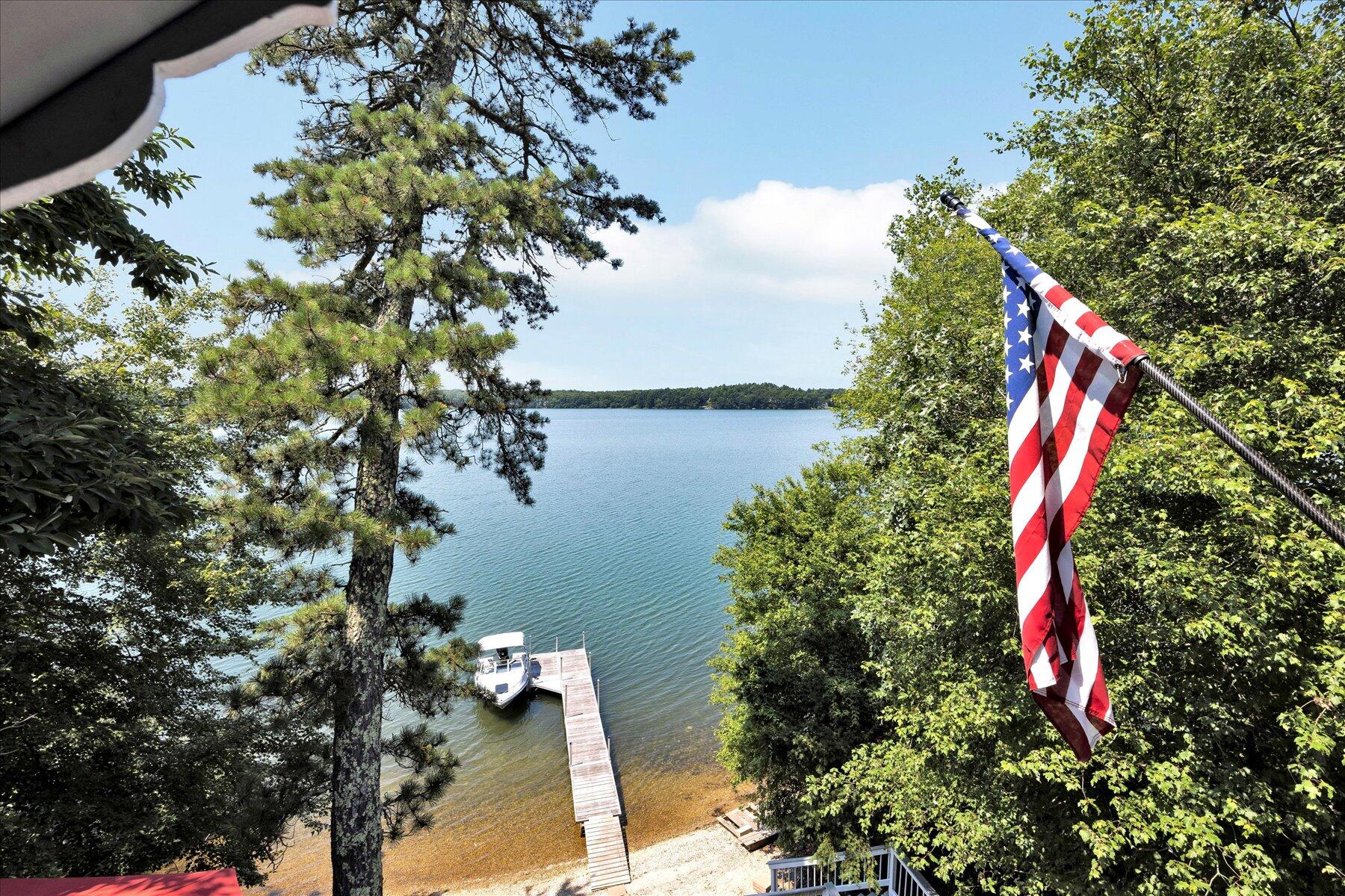 120 Wheeler Road Mashpee, MA 02649 - Photo 27 of 49 a view of a house with a yard and a large tree