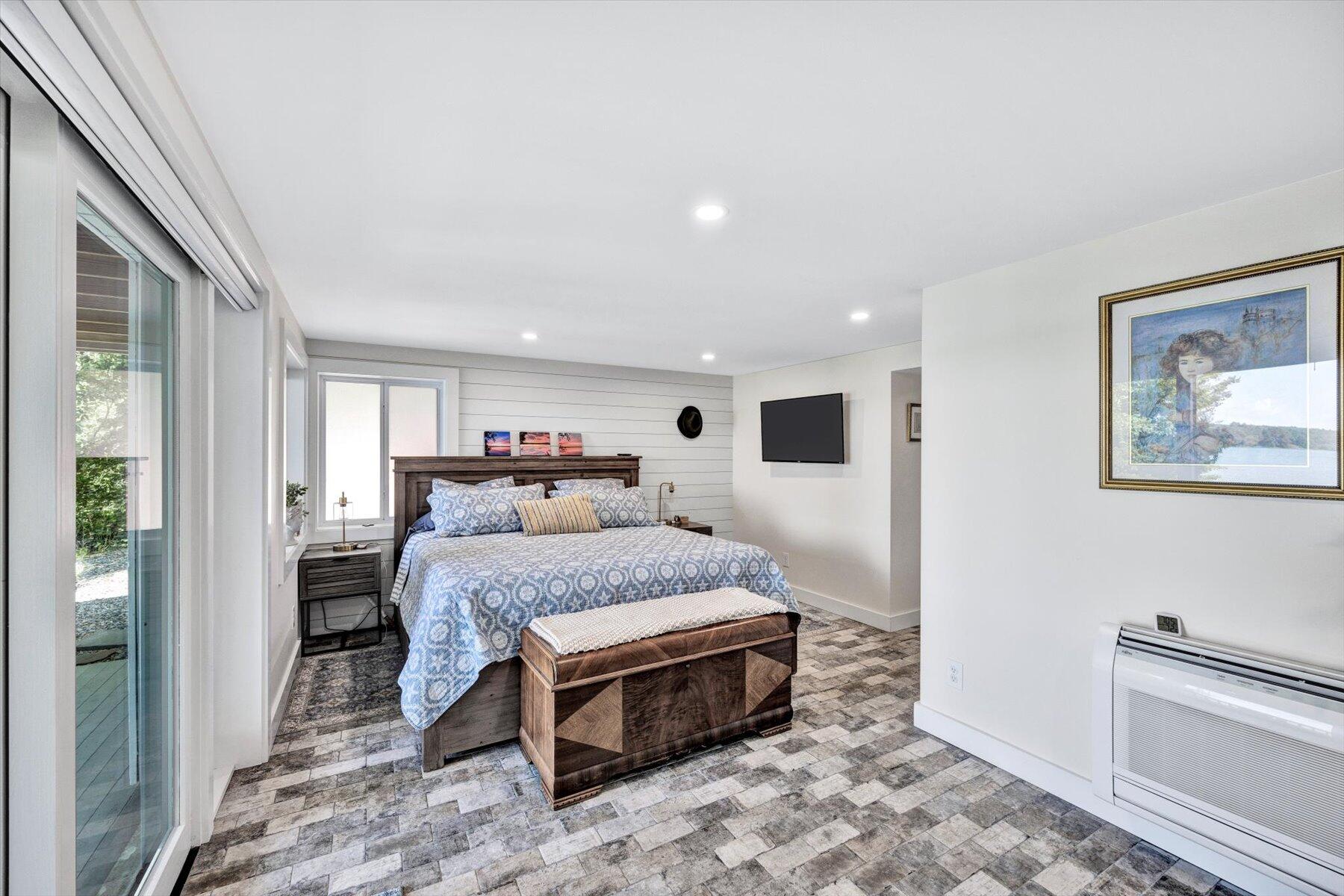 120 Wheeler Road Mashpee, MA 02649 - Photo 31 of 49 a spacious bedroom with a bed and a refrigerator