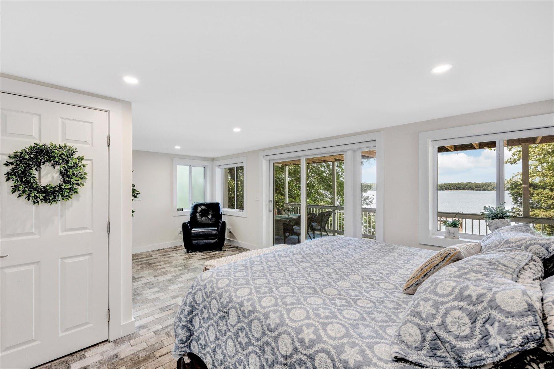 120 Wheeler Road Mashpee, MA 02649 - Photo 32 of 49 a bedroom with a bed and large windows