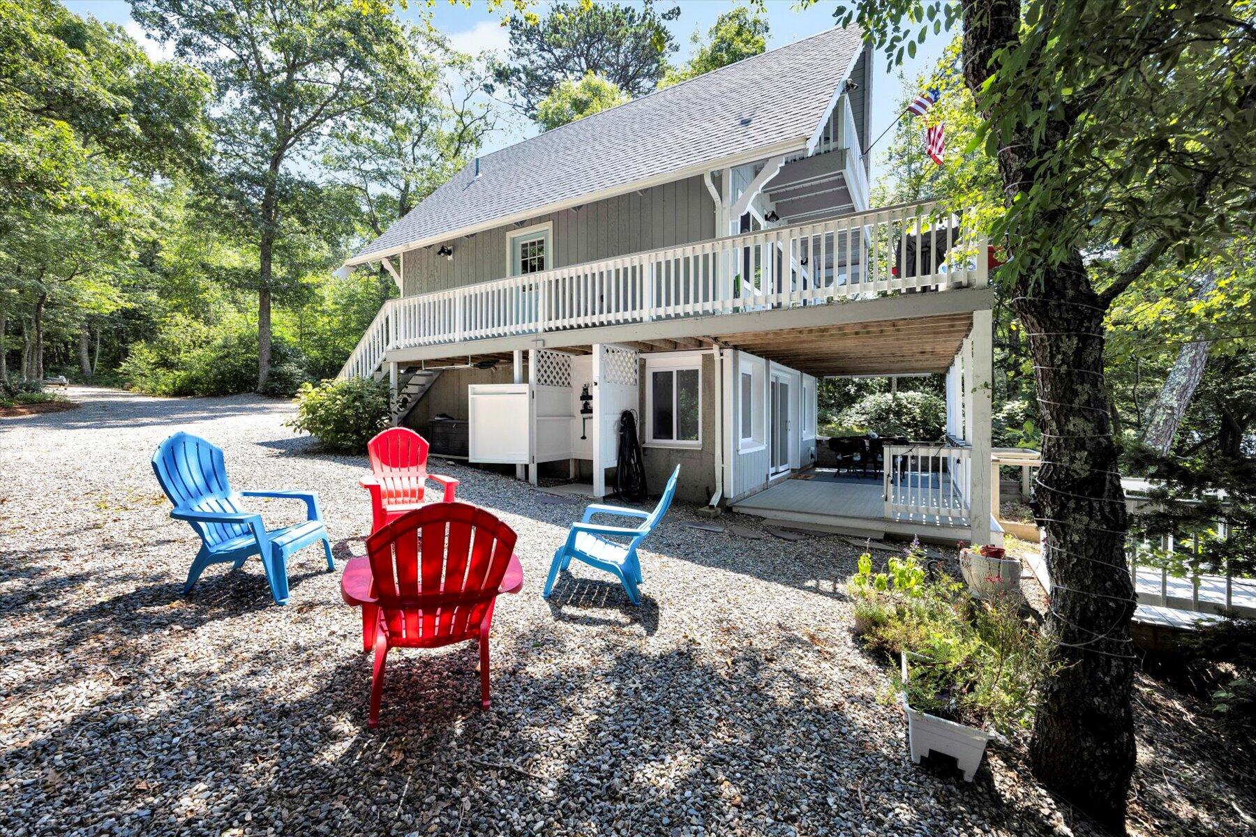 120 Wheeler Road Mashpee, MA 02649 - Photo 37 of 49 a view of a house with backyard and sitting area