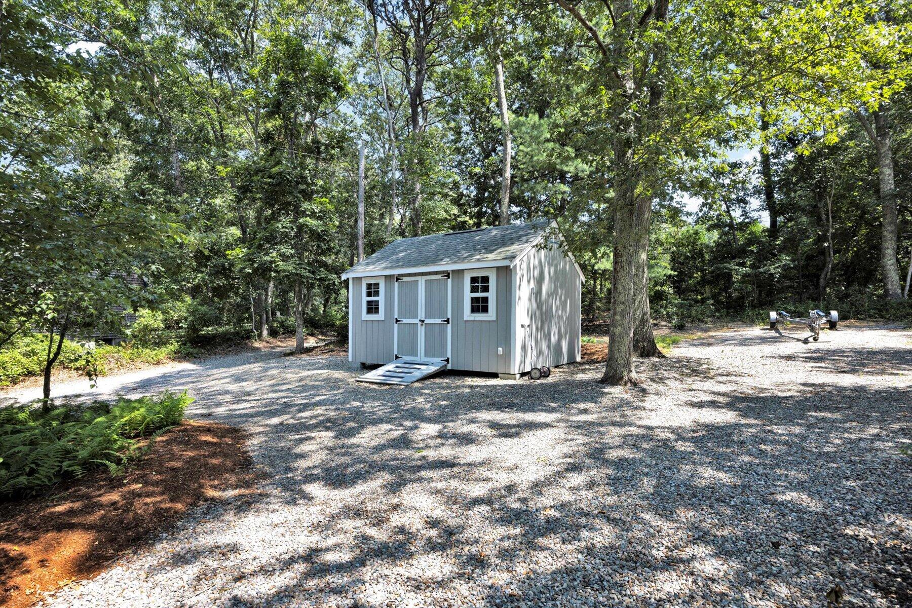 120 Wheeler Road Mashpee, MA 02649 - Photo 38 of 49 a view of a house with a yard