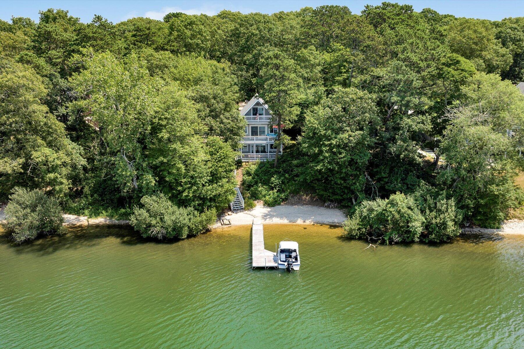 120 Wheeler Road Mashpee, MA 02649 - Photo 40 of 49 a view of a house with a yard