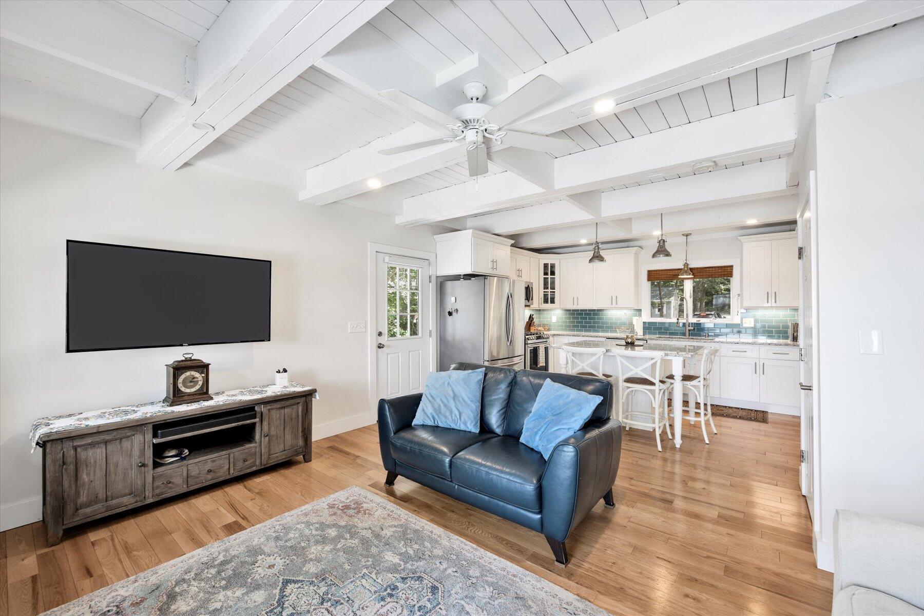 120 Wheeler Road Mashpee, MA 02649 - Photo 10 of 49 a living room with furniture and a flat screen tv