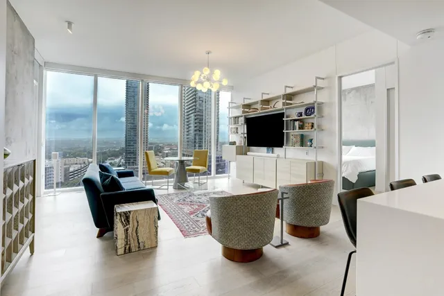 a living room with fireplace furniture and a flat screen tv