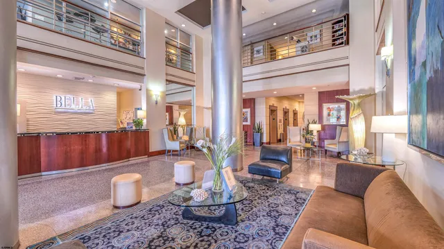 a lobby with furniture and wooden floor