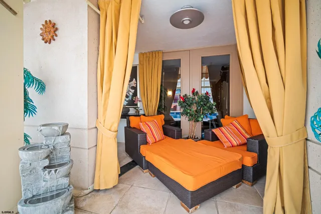 a living room with furniture a dining table and chairs