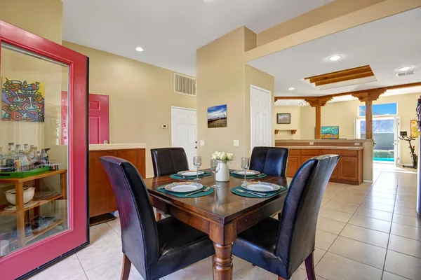 a dining room with furniture and window