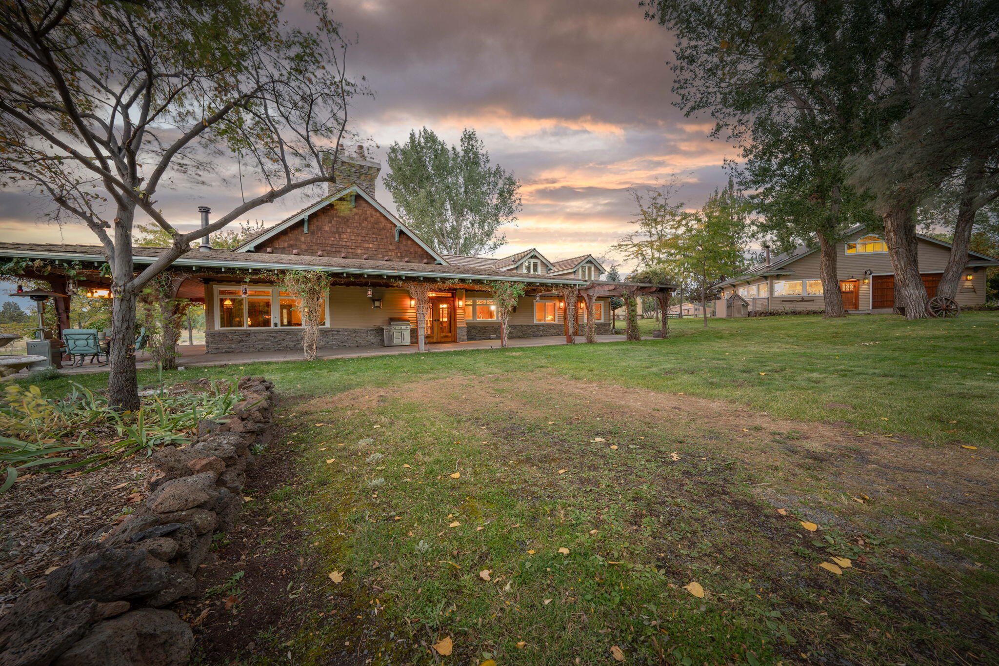 21925 Bear Creek Road Bend, OR 97702 - Photo 97 of 104 a front view of a house with garden