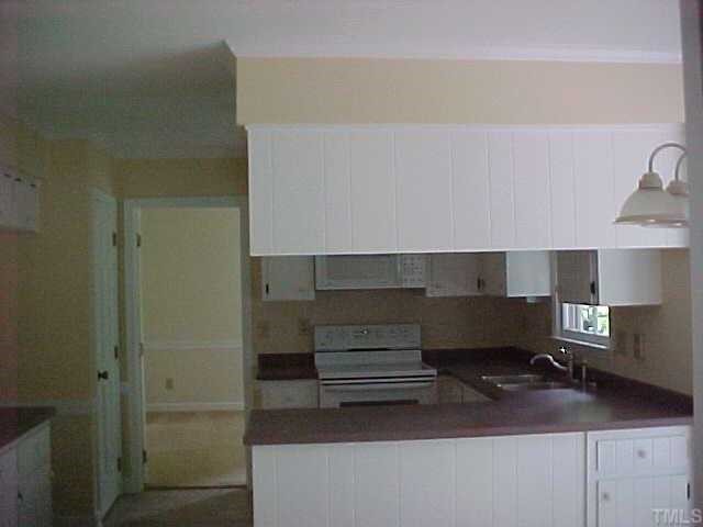 2000 Flagstone Place Raleigh, NC 27612 - Photo 8 of 10 Large Kitchen with smooth top range, moldings and new countertops.