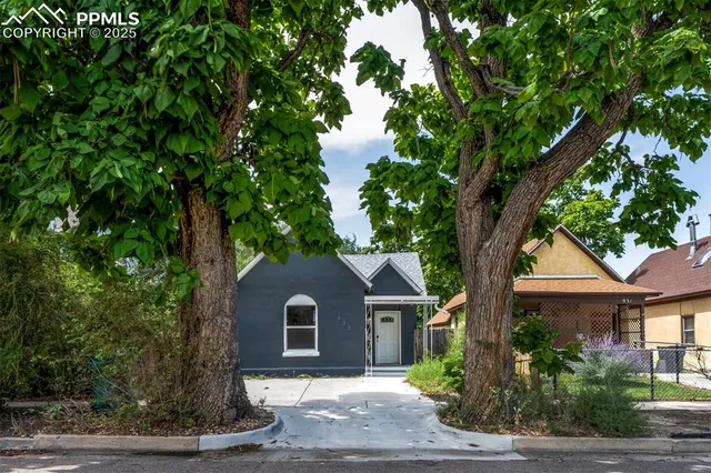 a front view of a house with yard